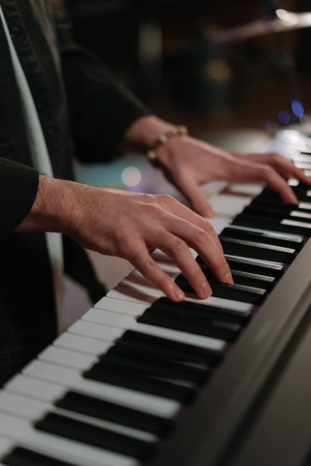 A pianist's hands moving across the keys